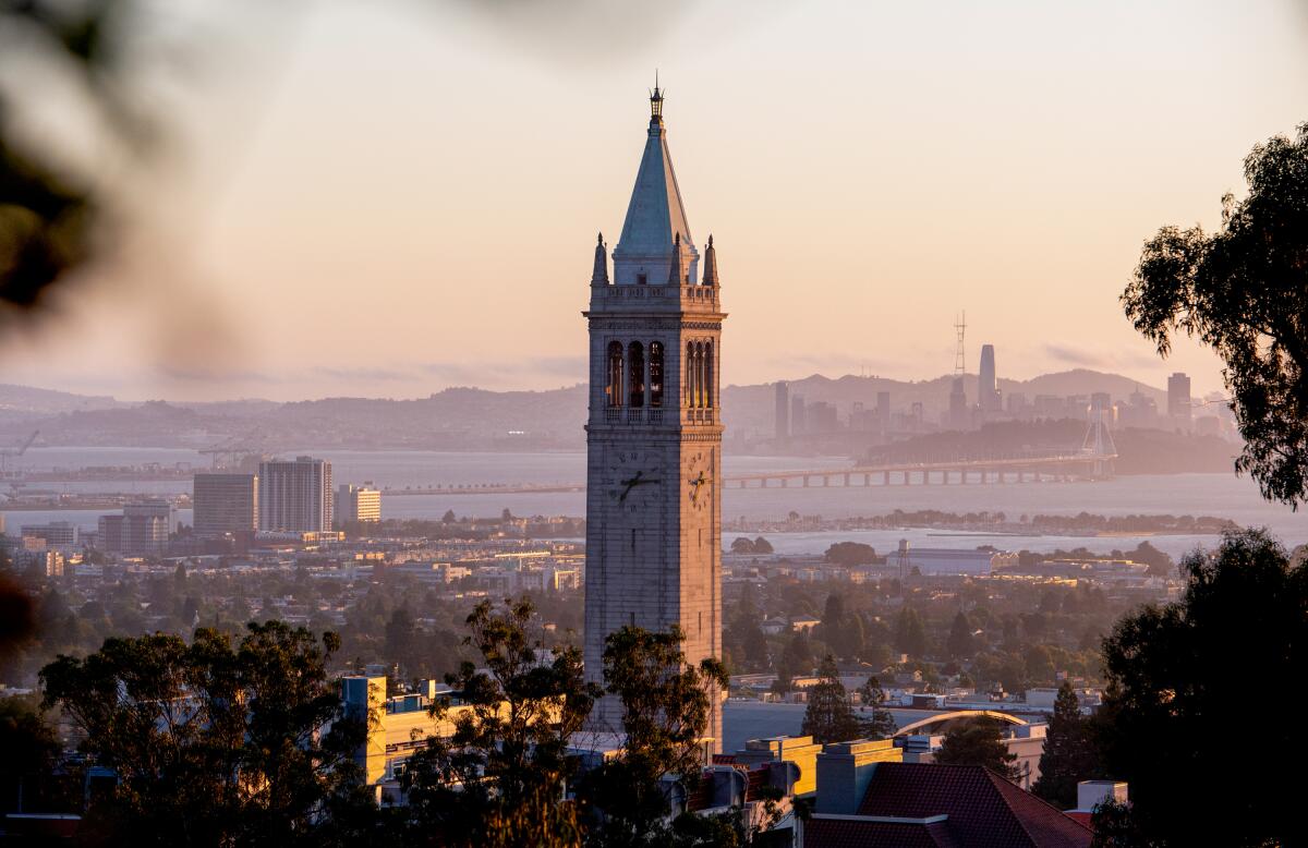 Sather Tower (the Campanile) at UC Berkeley at sunrise, overlooking the San Francisco Bay