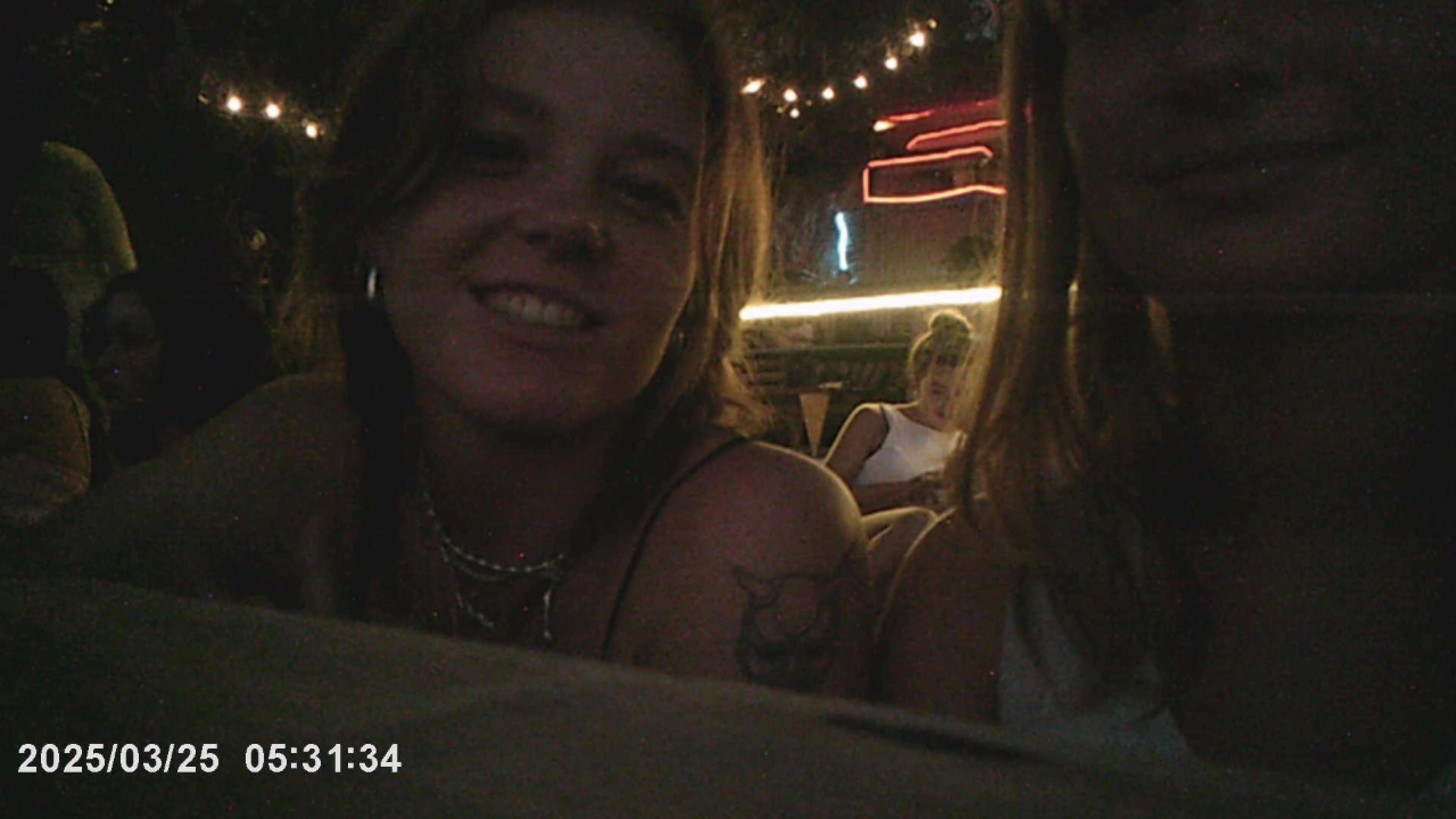 Nica and me smiling at Sunset Bar, Koh Tao, Thailand, string lights overhead